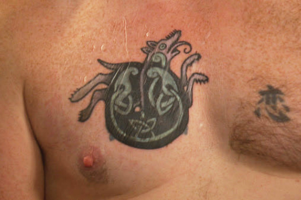 In this photo provided by WGME, Graham Platner, a democratic candidate for U.S. Senate, shows a cover-up tattoo that had previously been an image recognized as a Nazi symbol, during an interview on Wednesday, Oct. 22, 2025, in Portland, Maine. (WGME via AP)
