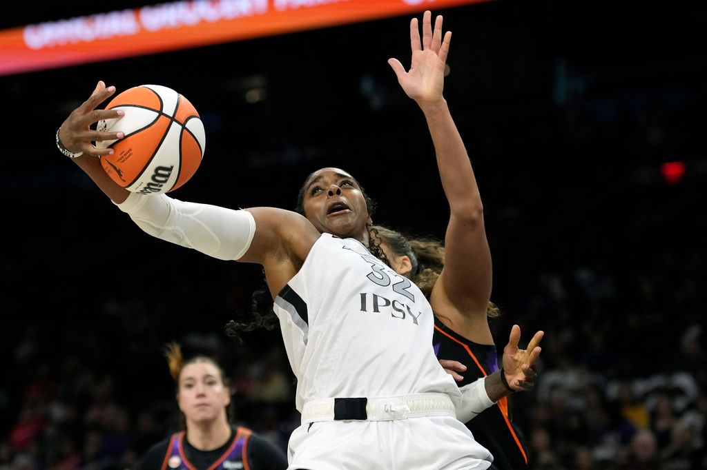 Las Vegas Aces forward Cheyenne Parker-Tyus grabs a rebound against the Phoenix Mercury during the second half of a WNBA basketball game, Thursday, Sept. 24, 2026, in Phoenix. (AP Photo/Ross D. Franklin)