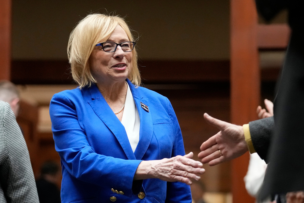 FILE - Democratic Gov. Janet Mills, greets lawmakers prior to delivering her State of the State address, Jan. 30, 2024, at the State House in Augusta, Maine. (AP Photo/Robert F. Bukaty, FIle)