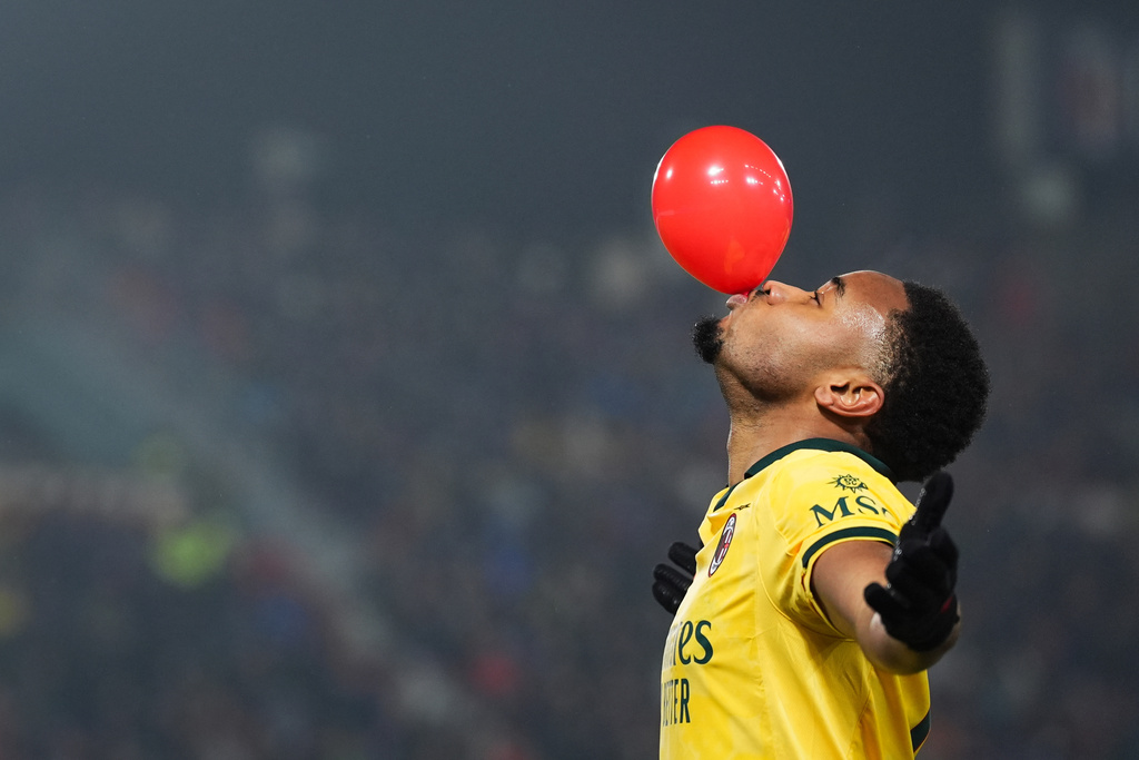 AC Milan's Christopher Nkunku celebrates after scoring their second goal during the Serie A soccer match between Bologna and Milan in Bologna, Italy, Tuesday Feb. 3, 2026. (Massimo Paolone/LaPresse via AP)