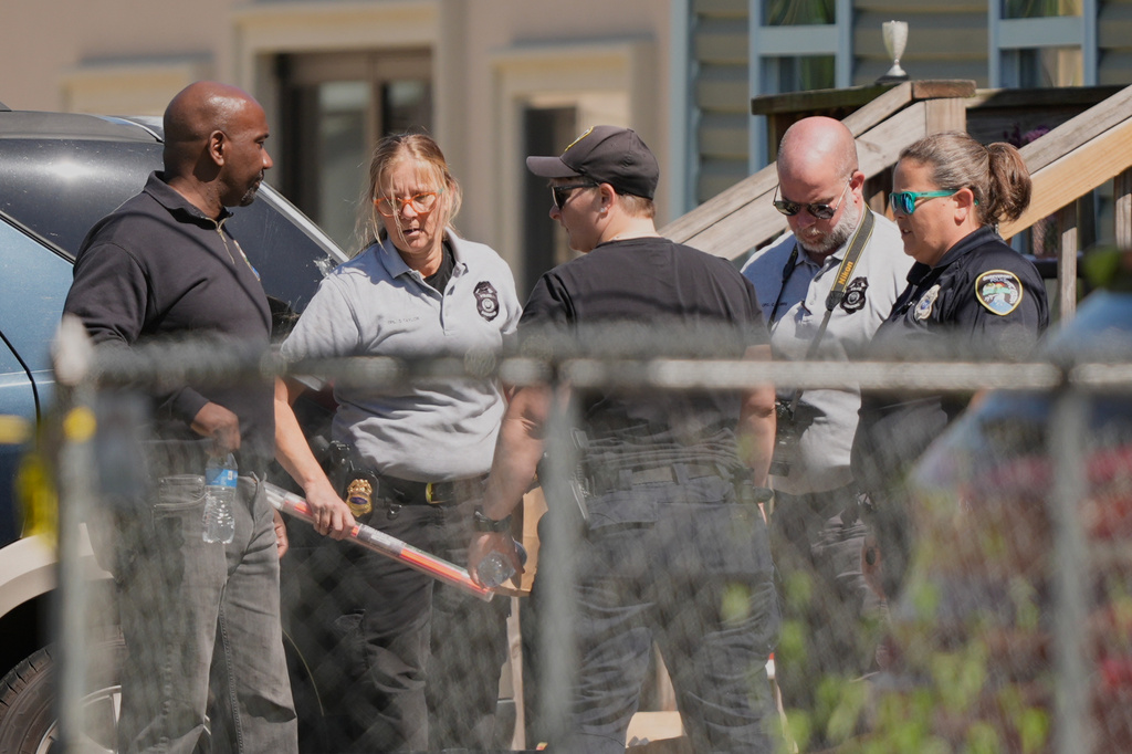 Police work outside the scene of a mass shooting, Sunday, April 19, 2026, in Shreveport, La. (AP Photo/Gerald Herbert)