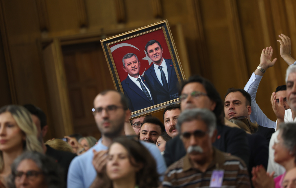 Supporters of Turkey's deposed main opposition Republican People's Party (CHP) leader Ozgur Ozel listen to him during a parliamentary group meeting in Ankara, Turkey, Tuesday, July 21, 2026. (Yavuz Ozden/DIA Photo via AP)