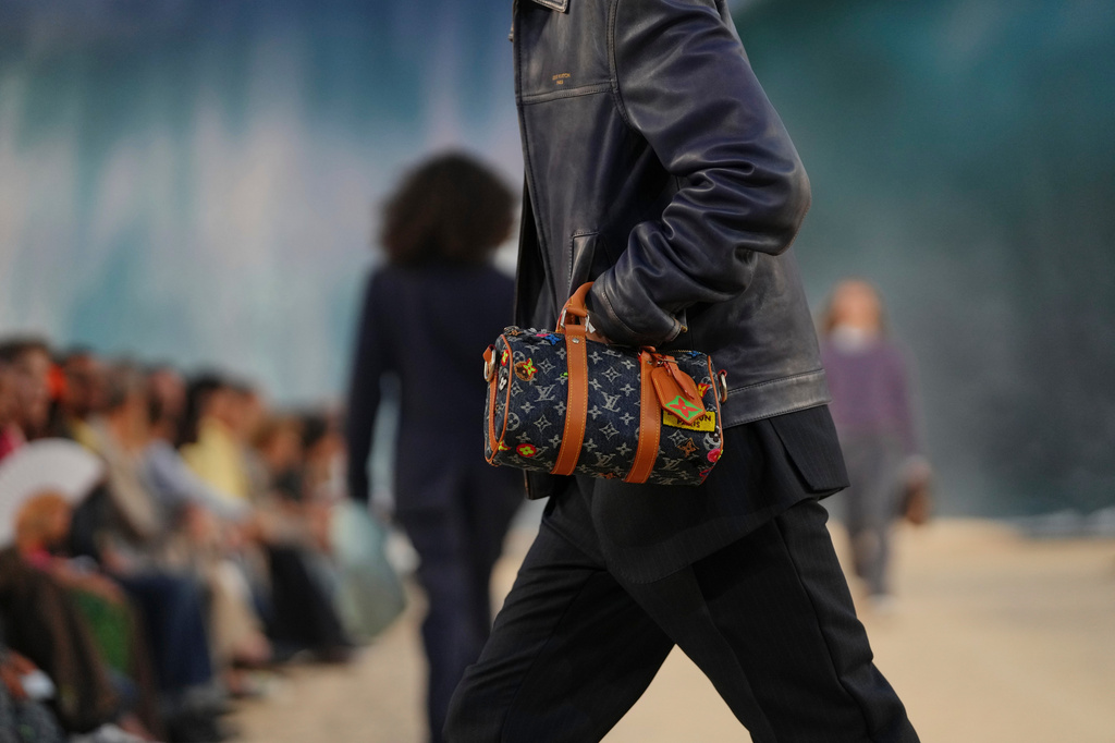 A model wears a creation as part of the Louis Vuitton men's Spring Summer 2027 collection presented in Paris, France, Tuesday, June 23, 2026. (AP Photo/Aurelien Morissard)