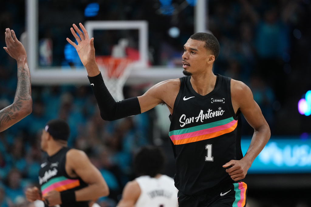 San Antonio Spurs forward Victor Wembanyama (1) celebrates a play against the Portland Trail Blazers during the first half in Game 1 of a first-round NBA playoffs basketball series in San Antonio, Sunday, April 19, 2026. (AP Photo/Eric Gay)