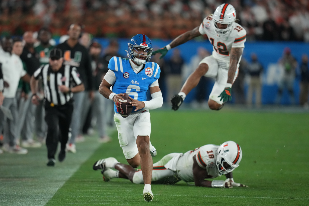 Mississippi quarterback Trinidad Chambliss (6) runs the ball during the second half of the Fiesta Bowl NCAA college football playoff semifinal game against Miami, Thursday, Jan. 8, 2026, in Glendale, Ariz. (AP Photo/Rick Scuteri)