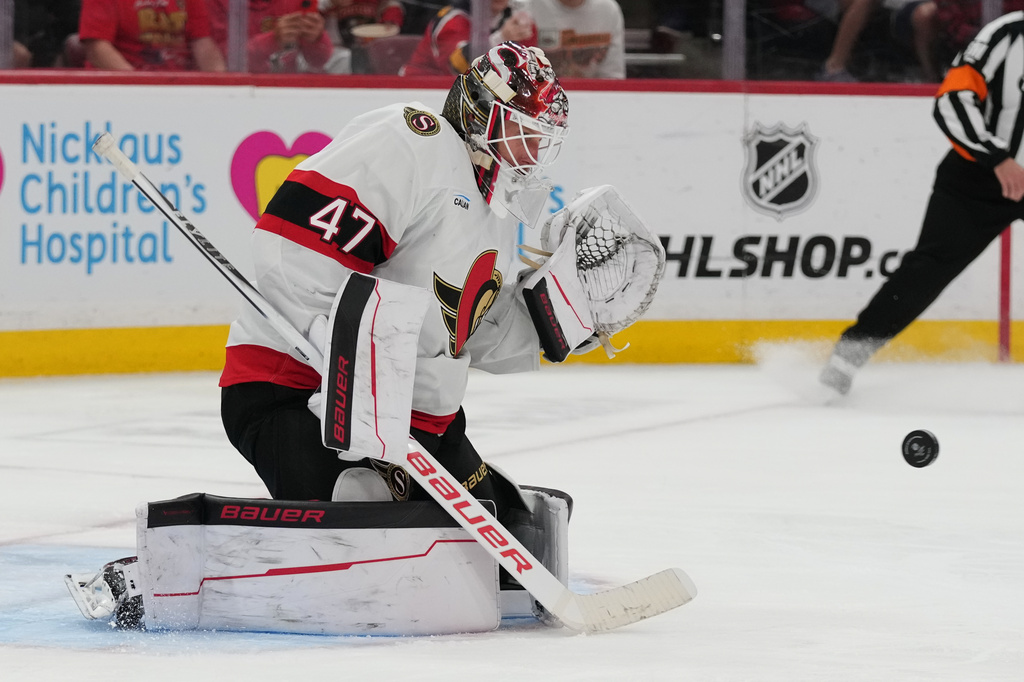 Ottawa Senators goaltender James Reimer (47) stops a shot on the goal by Florida Panthers center Sam Bennett during the second period of an NHL hockey game, Tuesday, March 31, 2026, in Sunrise, Fla. (AP Photo/Lynne Sladky)