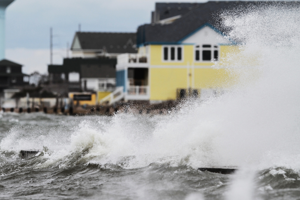 FILE - Strong west winds from the approaching winter storm push Pamlico Sound water towards Hatteras Island near Rodanthe, N.C., March 6, 2013. (Steve Earley/The Virginian-Pilot via AP, File)