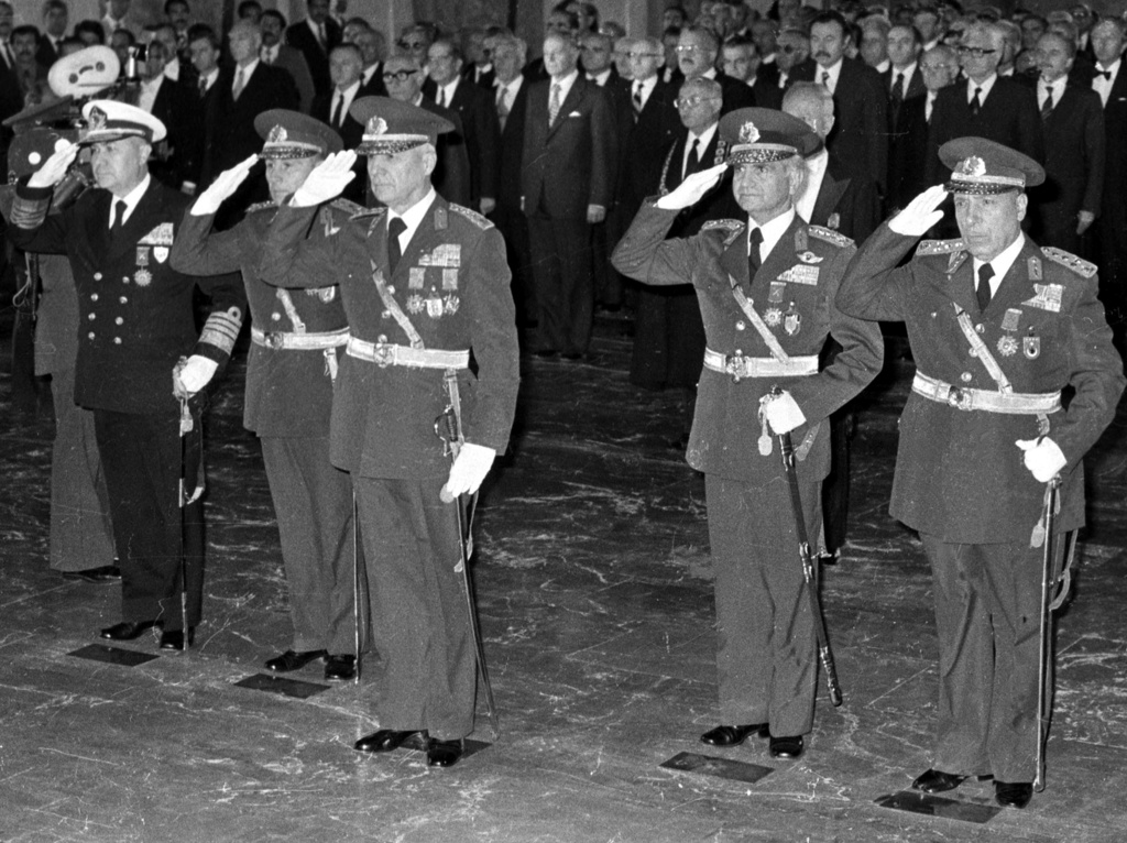 FILE - Gen. Kenan Evren, center, stands with the other leaders of the Sept. 12 military coup during a ceremony at the mausoleum of the founder of modern Turkey, Kemal Ataturk, in Ankara, Turkey, Oct. 29, 1980. (AP Photo/Burhan Ozbilici, File)