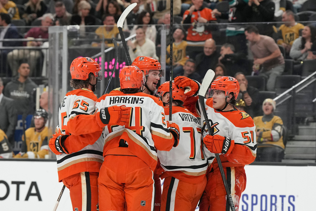Anaheim Ducks right wing Frank Vatrano (77) celebrates with teammates after his first-period goal against the Vegas Golden Knights in an NHL hockey game Saturday, Nov. 8, 2025, in Las Vegas. (AP Photo/Candice Ward)