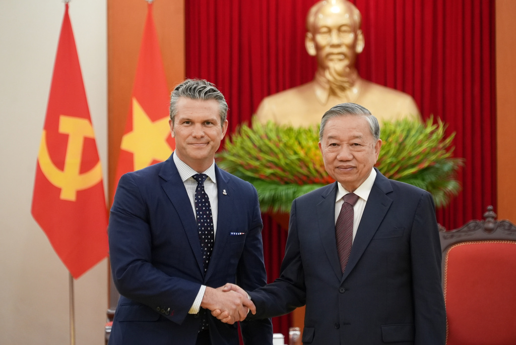 U.S. Defense Secretary Pete Hegseth and General Secretary of Vietnam's Communist Party To Lam shake hands in Hanoi, Vietnam, Sunday, Nov. 2, 2025. (AP Photo/Hau Dinh)
