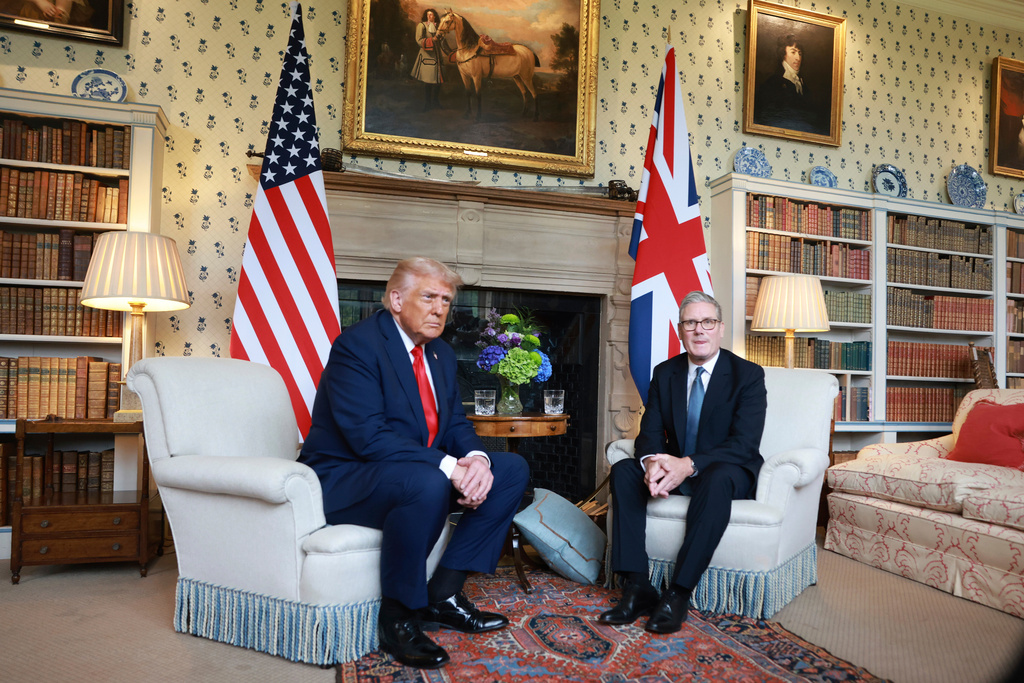 President Donald Trump, left, is greeted by Britain's Prime Minister Keir Starmer as he visits the prime minister's country residence Chequers, near Aylesbury, England, Thursday, Sept. 18, 2025. (Ian Vogler/Pool Photo via AP)