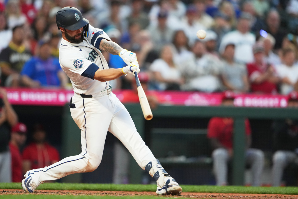 Seattle Mariners' Weston Wilson hits an RBI double to score Luke Raley against the Cincinnati Reds during the seventh inning of a baseball game, Monday, July 20, 2026, in Seattle. (AP Photo/Lindsey Wasson)