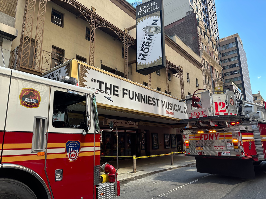 Firetrucks are parked outside of the Eugene O'Neill Theatre in New York on Monday, May 4, 2026. (AP Photo/David Martin)