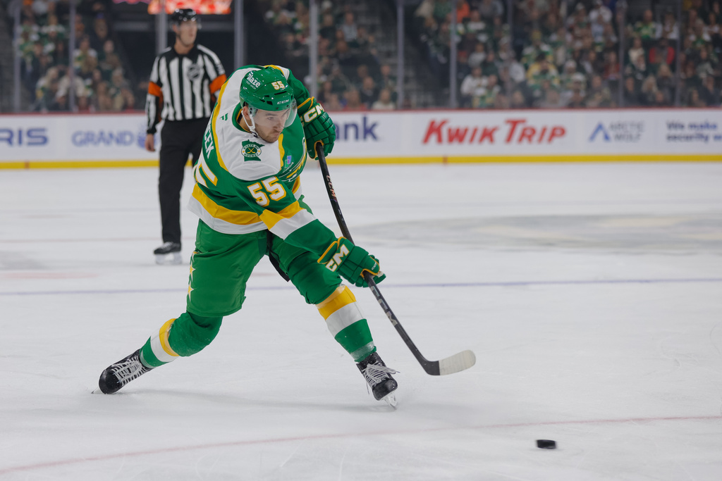 Minnesota Wild defenseman David Jiricek (55) takes a slapshot during the first period of an NHL hockey game against the Utah Mammoth, Saturday, Oct. 25, 2025, in St. Paul, Minn. (AP Photo/Bailey Hillesheim)