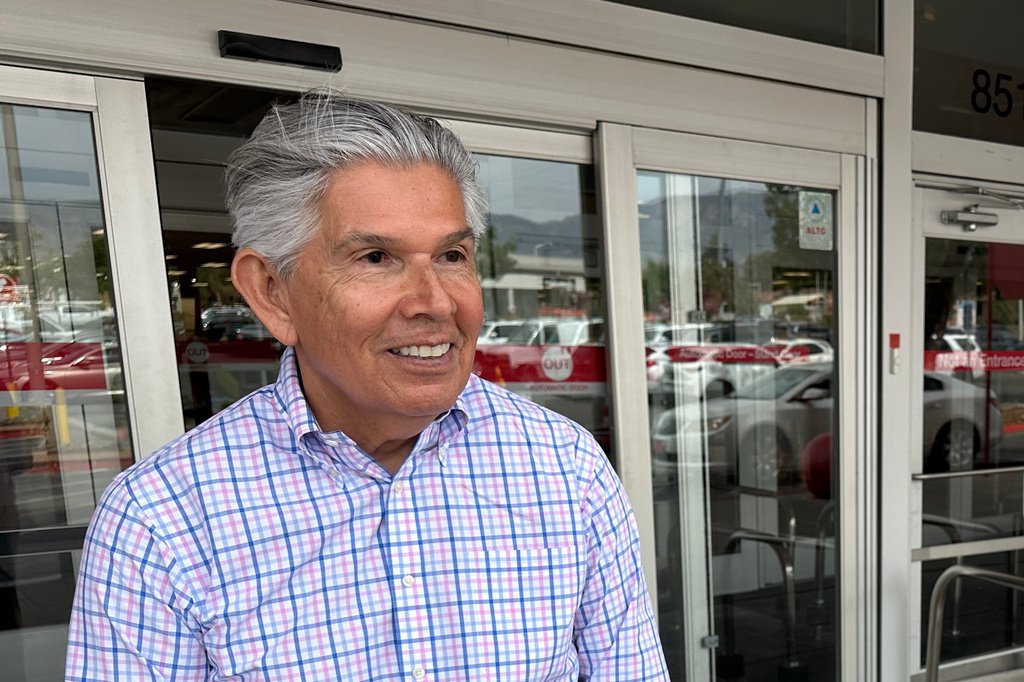 FILE - Republican gubernatorial candidate Duke Rodriguez talks with a voter in Albuquerque, N.M., Tuesday, June 2, 2026. (AP Photo/Susan Montoya Bryan, File)