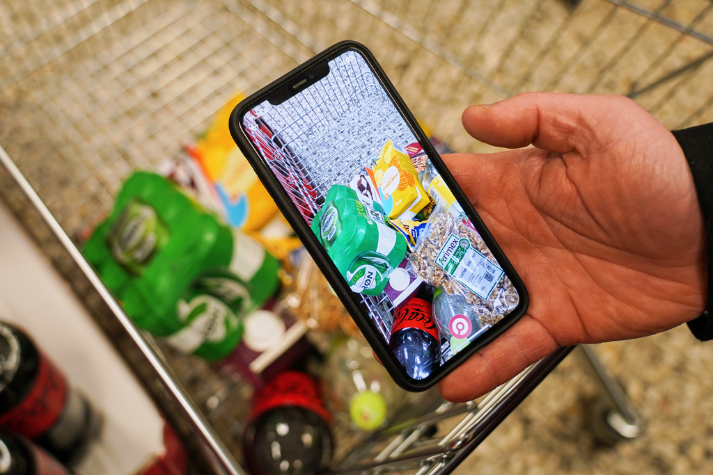 The mobile app "Made O'Meter", developed to help shoppers to identify and boycott American goods, is shown on a smartphone in a grocery store in Copenhagen, Wednesday, Jan. 28, 2026. (AP Photo/James Brooks)