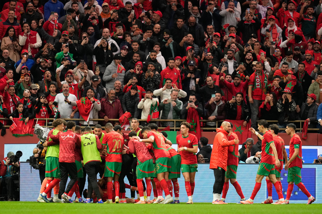 Moroccan players celebrate after teammate Brahim Abdelkader Diaz scored the opening goal during the Africa Cup of Nations round of 16 soccer match between Morocco and Tanzania in Rabat, Morocco, Sunday, Jan. 4, 2026. (AP Photo/Mosa'ab Elshamy)