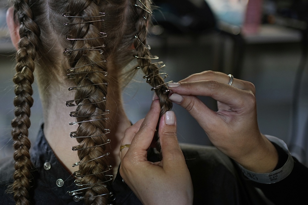 A model is prepared for a runway show at the backstage of the Moscow Fashion Week in Moscow, Russia, Friday, Aug. 29, 2025. (AP Photo/Pavel Bednyakov)
