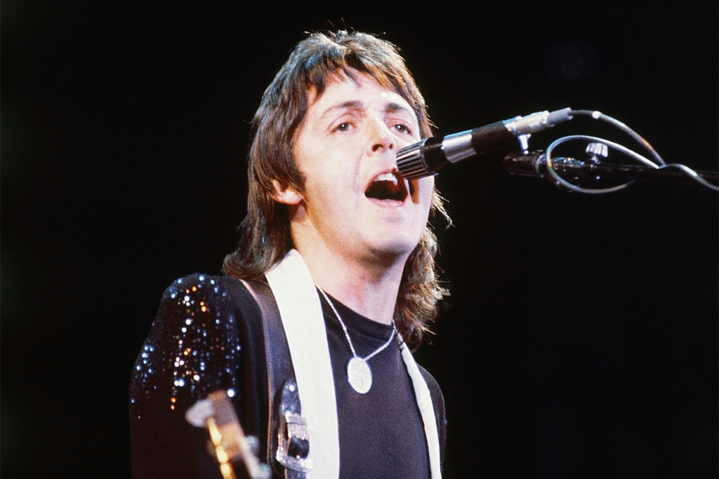 FILE - Paul McCartney, of Paul McCartney and Wings, performs at the Nassau Coliseum in Uniondale, N.Y. on May 21, 1976. (AP Photo/Richard Drew, File)