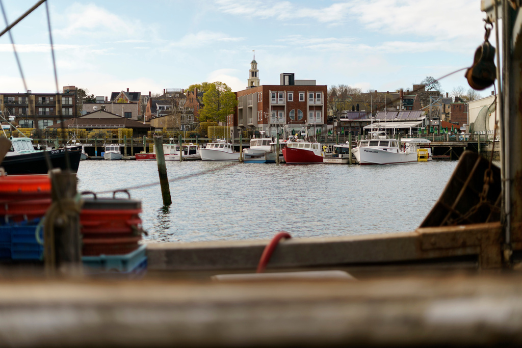 FILE - Fishing boats are docked in the harbor of Gloucester, Mass., May 11, 2022. (AP Photo/David Goldman, File)