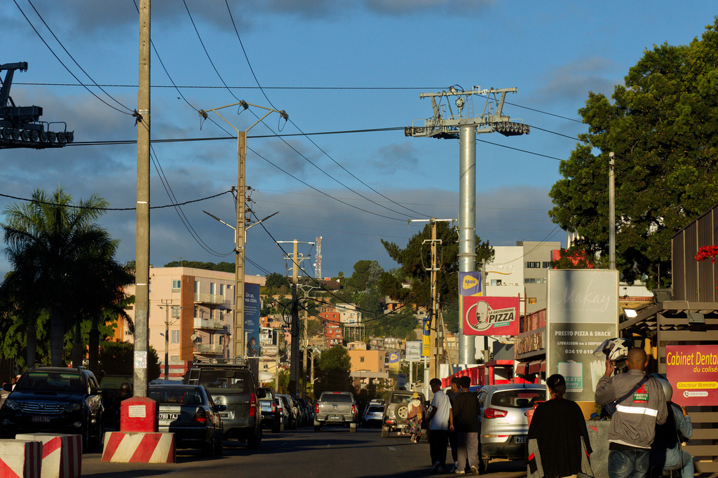 Wires for cable cars cut across the skyline of Antananarivo, Madagascar, Friday, May 1, 2026. (AP Photo/Alexander Joe)