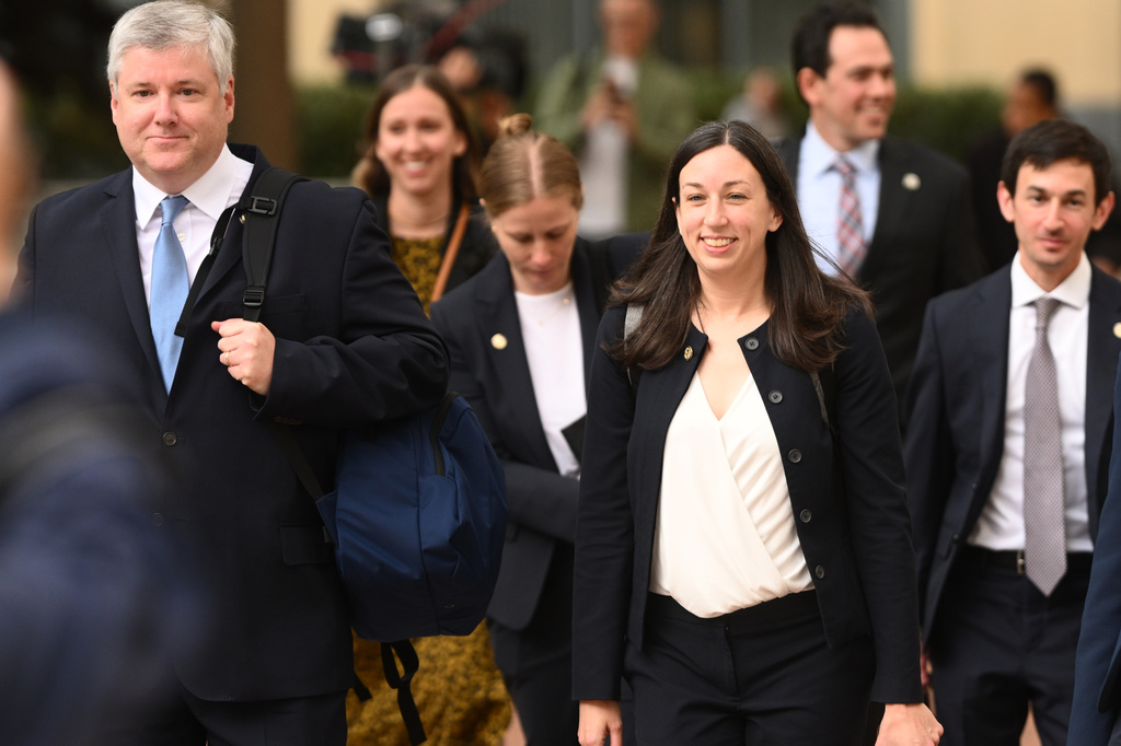 Nicklas Akers, California Senior Assistant Attorney General, left, and Deputy Attorney General Megan O'Neill exit court after tech giant Meta reached a settlement to end a landmark trial over teen social media addiction in Oakland, Calif., Wednesday, Aug. 26, 2026. (AP Photo/Noah Berger)