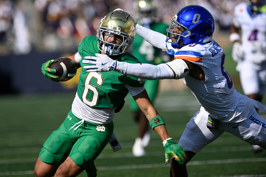 Notre Dame wide receiver Jordan Faison (6) catches a pass against Boise State's Ty Benefield (0) during the first quarter of an NCAA football game Saturday, Oct. 4, 2025, in South Bend, Ind. (AP Photo/Paul Beaty)