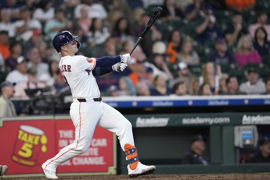 Houston Astros' Christian Walker hits a home run against the Colorado Rockies during the eighth inning of a baseball game Thursday, Aug. 28, 2025, in Houston. (AP Photo/David J. Phillip)