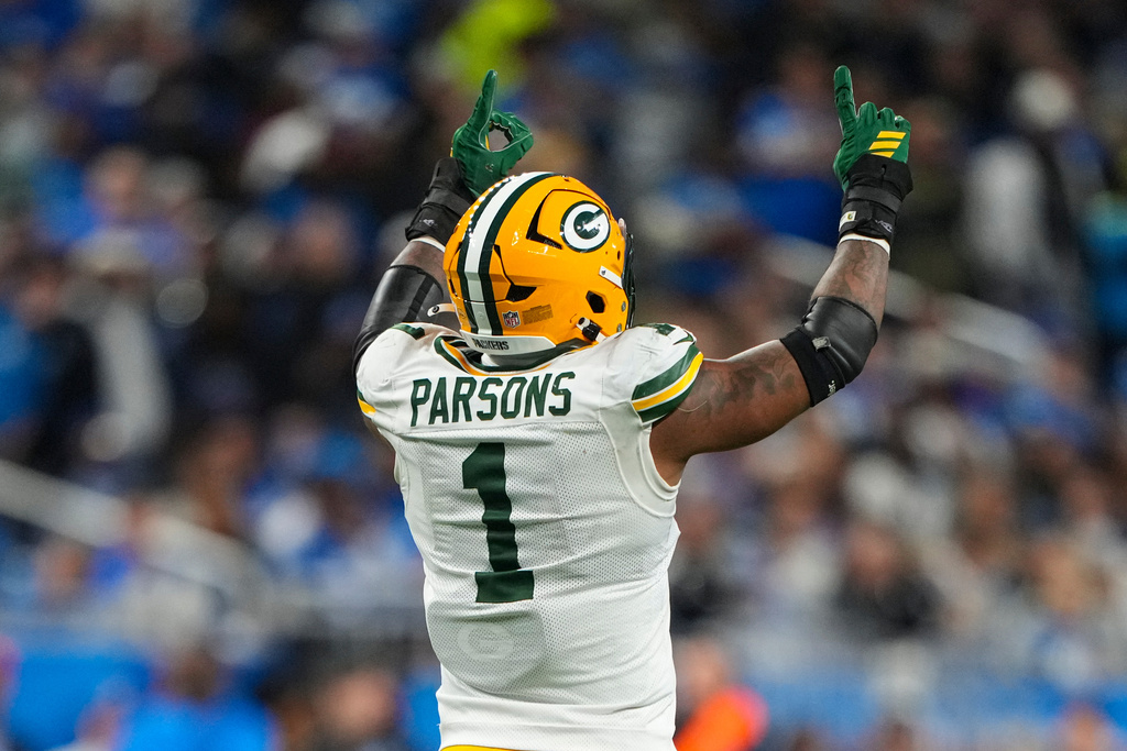 Green Bay Packers defensive lineman Micah Parsons (1) celebrates a sack against the Detroit Lions during the second half an NFL football game in Detroit, Thursday, Nov. 27, 2025. (AP Photo/Ryan Sun)