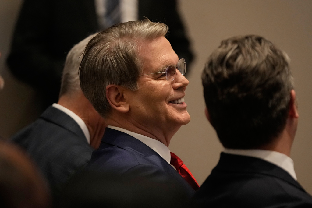 Treasury Secretary Scott Bessent, left, sits next to Defense Secretary Pete Hegseth as President Donald Trump speaks at the Shield of the Americas Summit, Saturday, March 7, 2026, at Trump National Doral Miami in Doral, Fla.(AP Photo/Mark Schiefelbein)