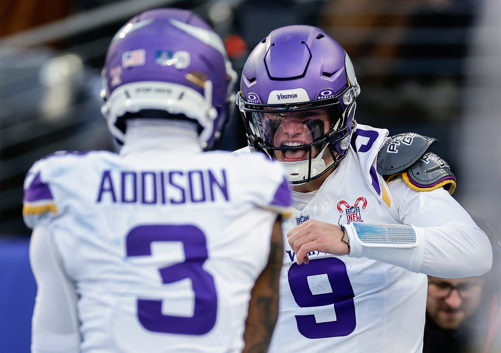 Minnesota Vikings quarterback J.J. McCarthy (9) celebrates after scoring a touchdown against the New York Giants during the second quarter of an NFL football game, Sunday, Dec. 21, 2025, in East Rutherford, N.J. (AP Photo/Adam Hunger)
