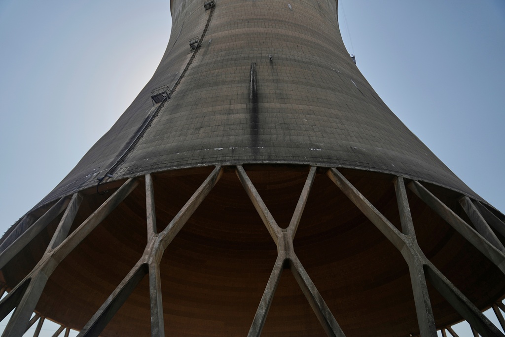 FILE - The base of a cooling tower at Constellation's nuclear power plant stands on Three Mile Island near Middletown, Pa., June 25, 2025. (AP Photo/Stephanie Scarbrough, File)