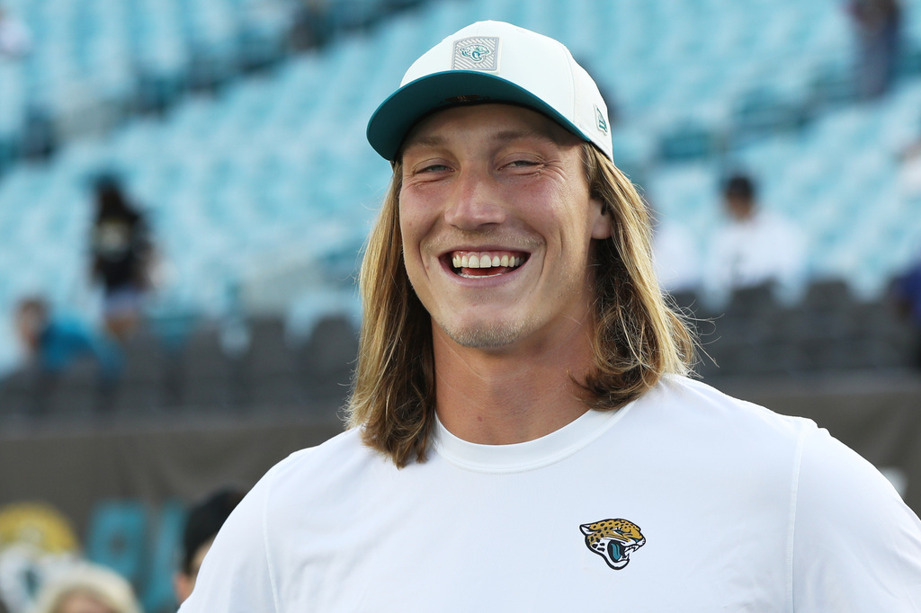 Jacksonville Jaguars quarterback Trevor Lawrence small before an NFL preseason football game between the Carolina Panthers and the Jacksonville Jaguars, Friday, Aug. 21, 2026, in Jacksonville, Fla. (AP Photo/Kelly Jordan)