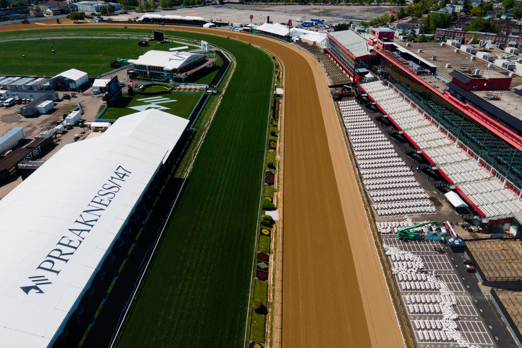 FILE - Rhe final straightaway at Pimlico Race Course is seen ahead of the 147th running of the Preakness Stakes horse race, May 19, 2022, in Baltimore. (AP Photo/Julio Cortez, File)