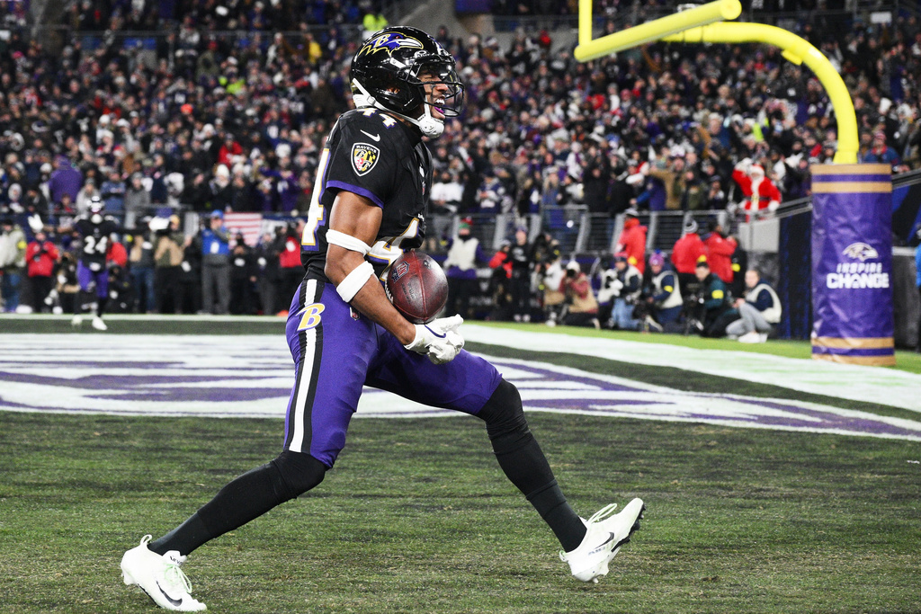 Baltimore Ravens cornerback Marlon Humphrey celebrates after intercepting a pass by New England Patriots quarterback Drake Maye during the first half of an NFL football game, Sunday, Dec. 21, 2025, in Baltimore. (AP Photo/Nick Wass)