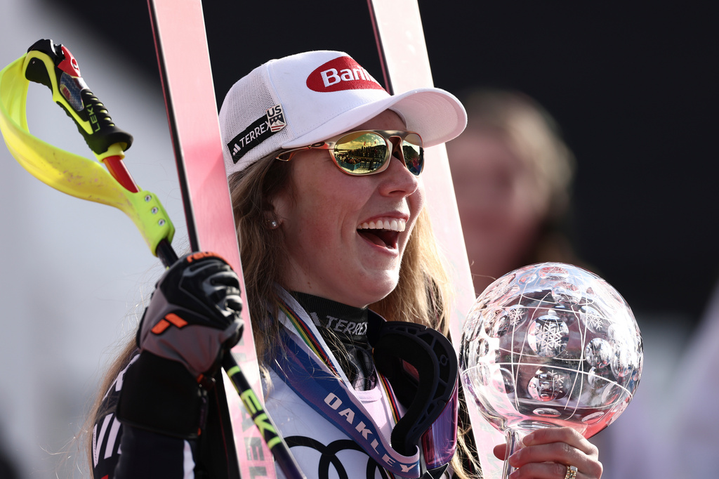 FILE - United States' Mikaela Shiffrin celebrates winning the globe trophy for the alpine ski women's slalom discipline at the Lillehammer World Cup Finals in Hafjell, Norway, March 24, 2026. (AP Photo/Gabriele Facciotti, File)