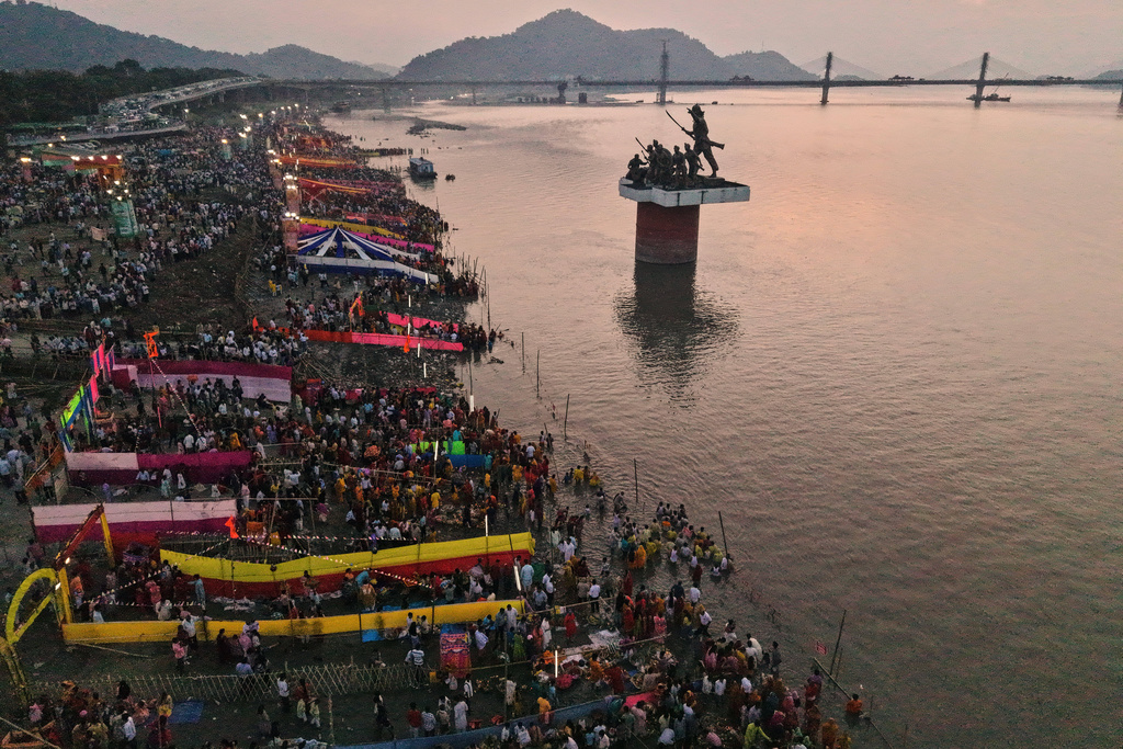 Indian Hindu devotees perform rituals in the the river Brahmaputra during the Chhath Puja festival in Guwahati, India, Monday, Oct. 27, 2025. (AP Photo/Anupam Nath)