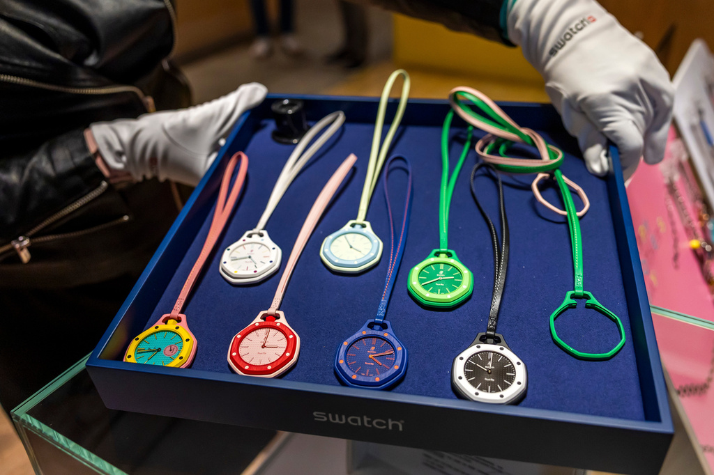 A saleswoman shows the new Royal Pop watches by Swatch and Audemars Piguet, in Geneva, Switzerland, Saturday, May 16, 2026. (Salvatore Di Nolfi/Keystone via AP)