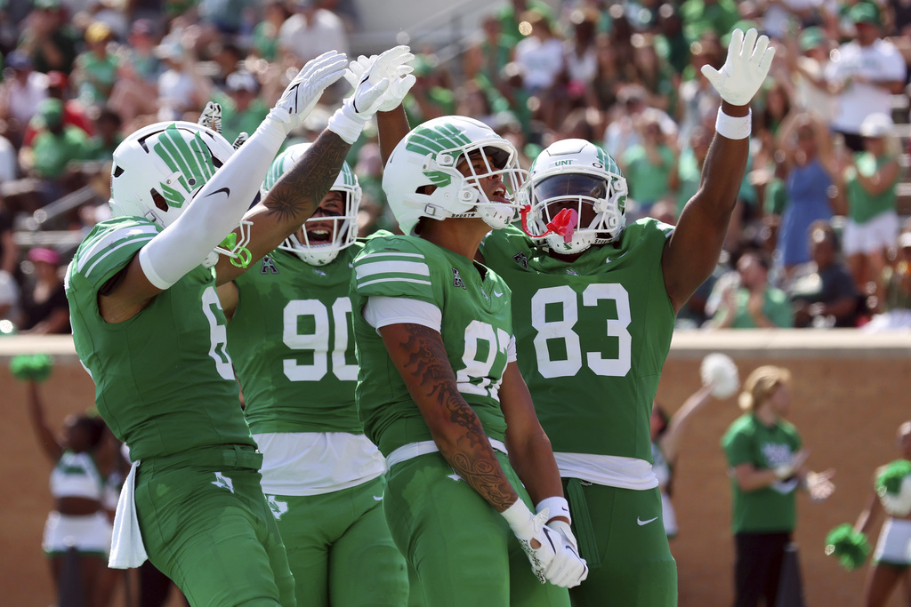 North Texas tight end Brandon Young Jr. (87) celebrates a touchdown against Washington State with Tre Williams III (6), Ethan Day (90), and Victor Aderungboye (83) during the second quarter of an NCAA college football game, Saturday, Sept. 13, 2025, in Denton, Texas. (AP Photo/Richard W. Rodriguez)