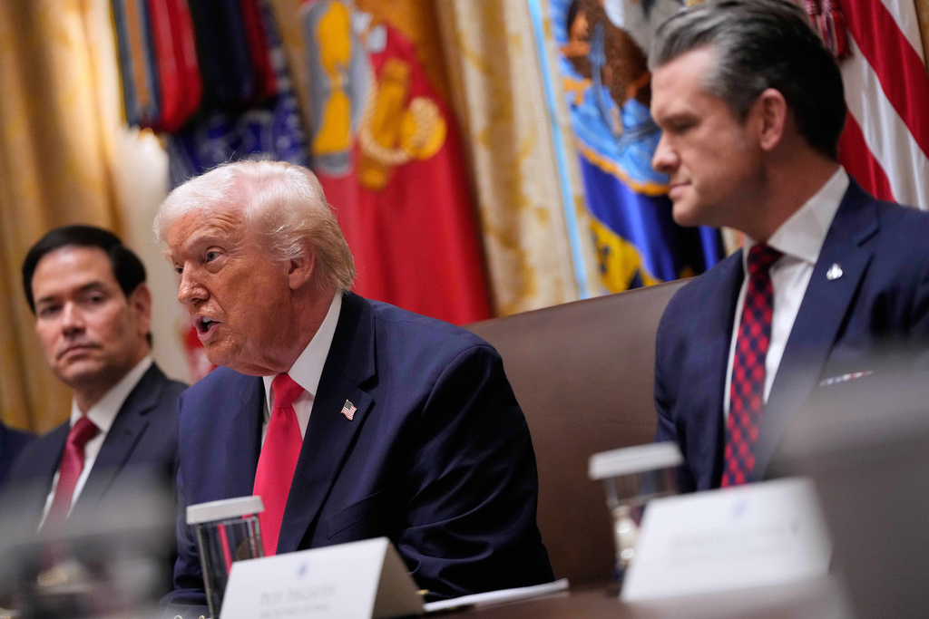 President Donald Trump speaks during a Cabinet meeting at the White House, Tuesday, Dec. 2, 2025, in Washington, as Secretary of State Marco Rubio and Defense Secretary Pete Hegseth, look on. (AP Photo/Julia Demaree Nikhinson)