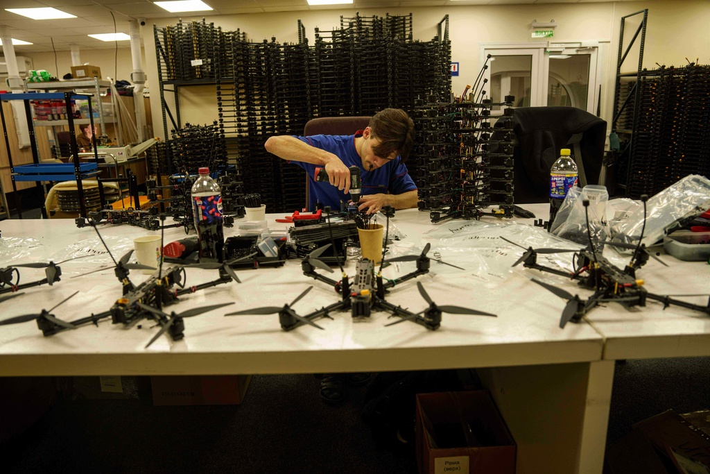 An engineer assembles FPV drone of "General Cherry" company at the workshop in Ukraine, on Dec. 4, 2025. (AP Photo/Evgeniy Maloletka)
