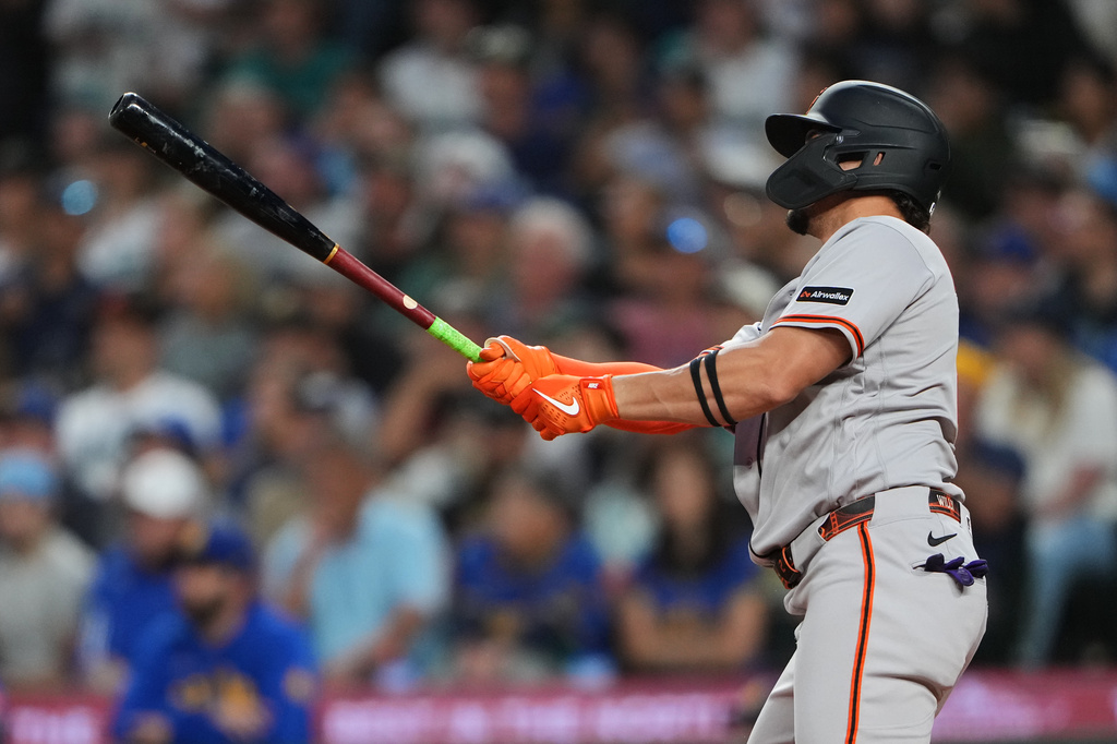 San Francisco Giants' Willy Adames follows through on a grand slam against the Seattle Mariners during the seventh inning of a baseball game, Friday, July 17, 2026, in Seattle. (AP Photo/Lindsey Wasson)