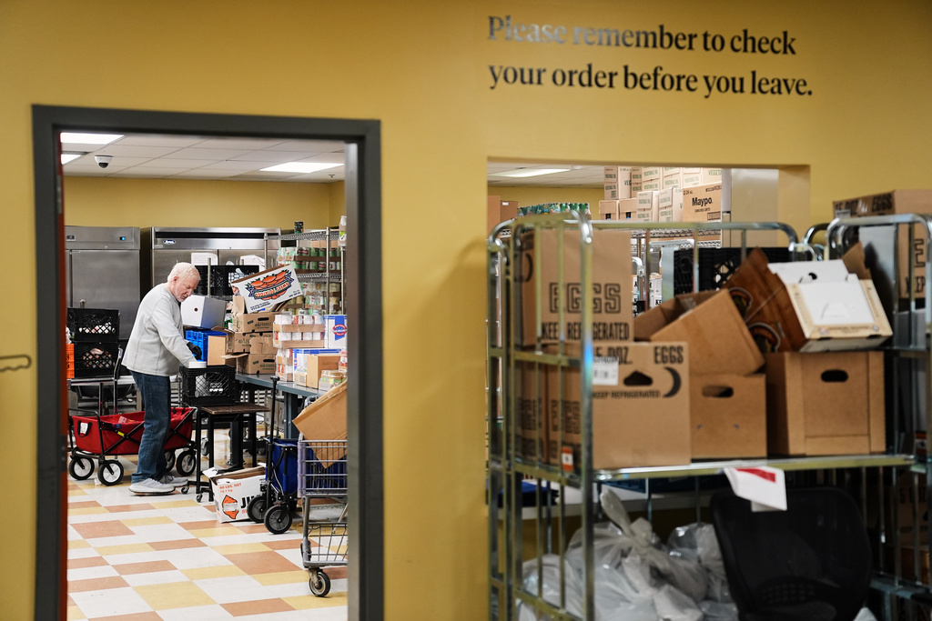 Volunteer Bruce Toben packs groceries durning an emergency food distribution at the at The Jewish Federation of Greater Philadelphia's Mitzvah Food Program in Philadelphia, Friday, Nov. 7, 2025. (AP Photo/Matt Rourke)
