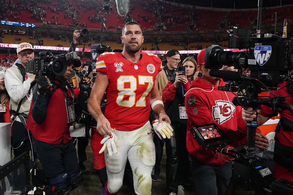 Kansas City Chiefs tight end Travis Kelce walks on the field following an NFL football game against the Denver Broncos Thursday, Dec. 25, 2025, in Kansas City. (AP Photo/Ed Zurga)