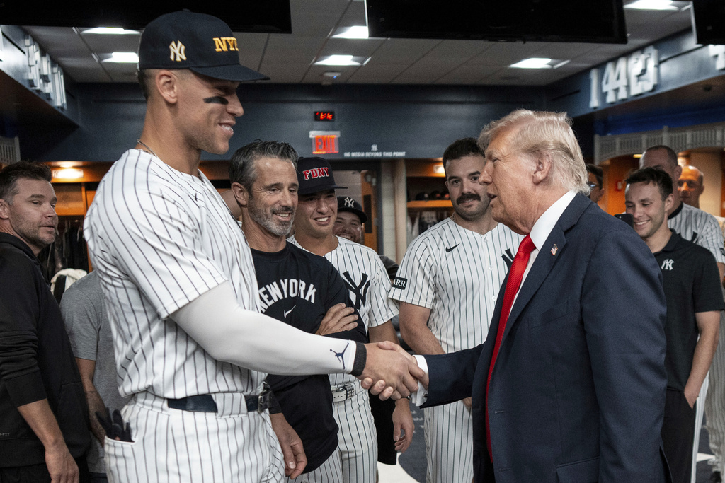 President Donald Trump shakes hands with New York Yankees Aaron Judge in the New York Yankees locker room before a baseball game against the Detroit Tigers, Thursday, Sept. 11, 2025, in New York. (Doug Mills//The New York Times via AP, Pool)