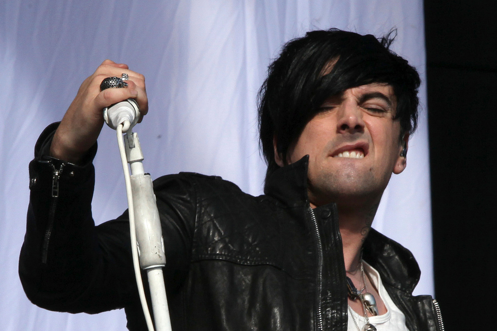 FILE - British musician Ian Watkins, lead singer of Lostprophets, as he performs on stage at V Music Festival in Hylands Park, Chelmsford, England on Aug 20, 2011. (AP Photo/Joel Ryan, File)