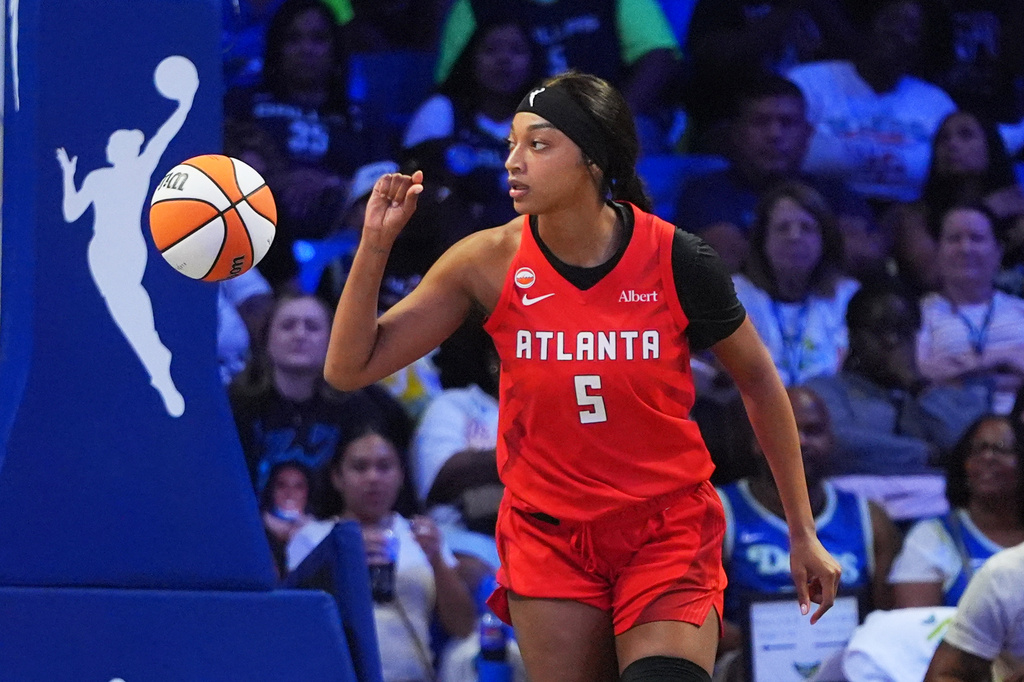 Atlanta Dream forward Angel Reese gestures after scoring a basket during the first half of a WNBA basketball game against the Dallas Wings in Arlington, Texas, Wednesday, July 29, 2026. (AP Photo/LM Otero)