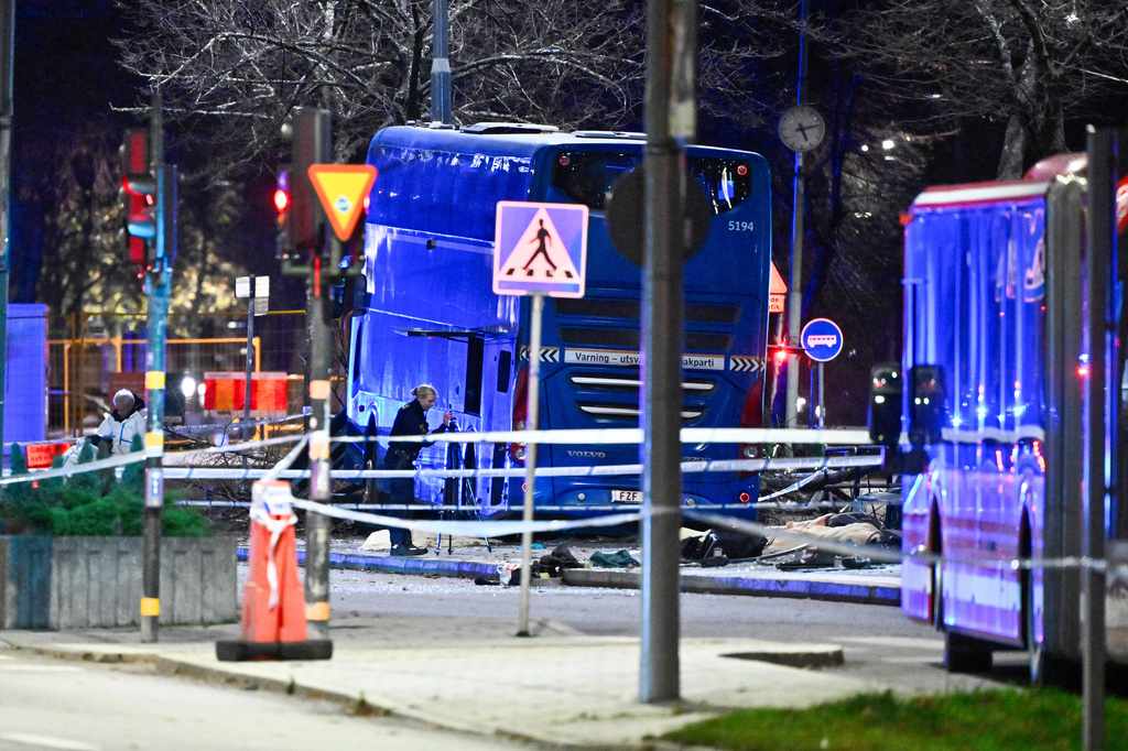 A double-decker bus crashed into a bus shelter in Stockholm on Friday, Nov. 14, 2025, causing fatalities and injuries. (Claudio Bresciani/TT News Agency via AP)