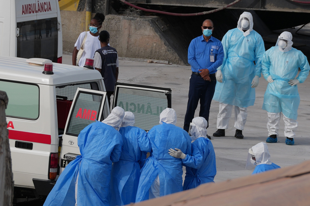 Health workers in protective gear evacuate patients from the MV Hondius cruise ship into an ambulance at a port in Praia, Cape Verde, Wednesday, May 6, 2026. (AP Photo/Misper Apawu)