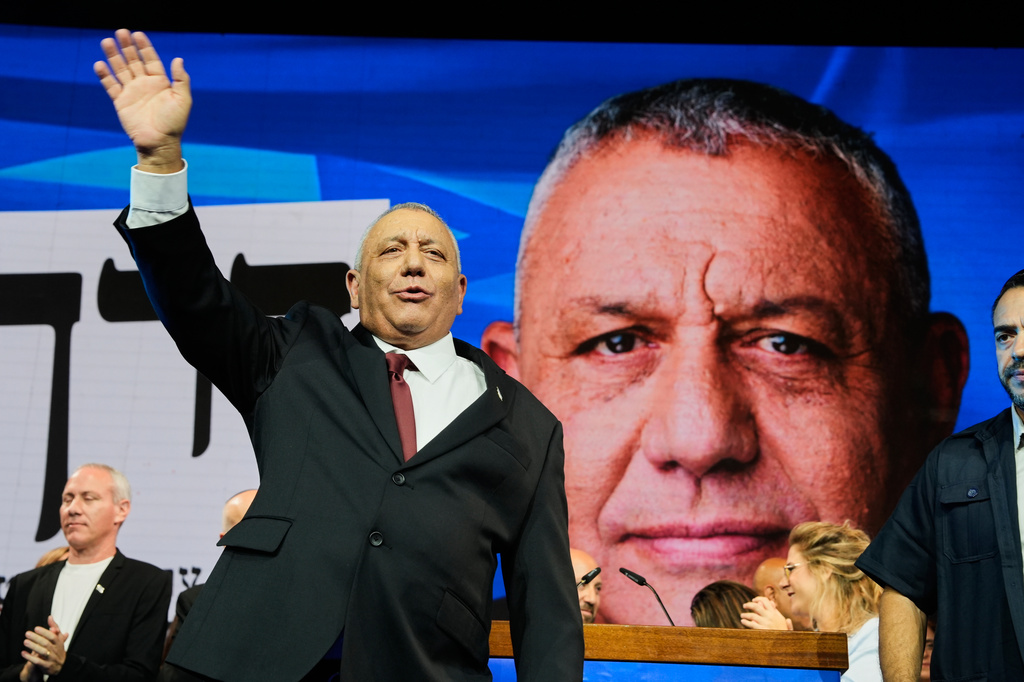 Gadi Eisenkot, leader of the Yashar ("Straight") party, waves to supporters following the release of the first exit poll results in Israel's general election in Tel Aviv, Israel, Wednesday, Oct. 28, 2026. (AP Photo/Baz Ratner)